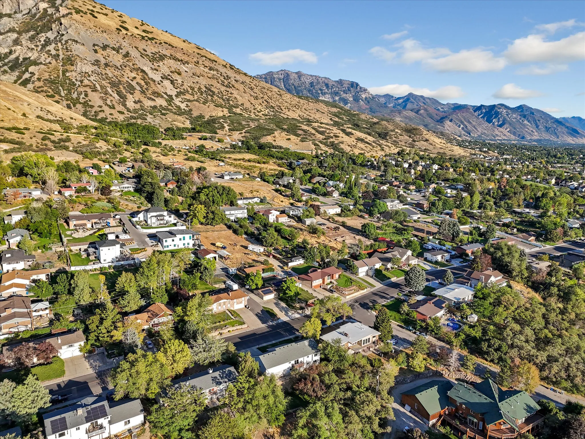 Elevated neighborhood setting with mountainous terrain backdrop