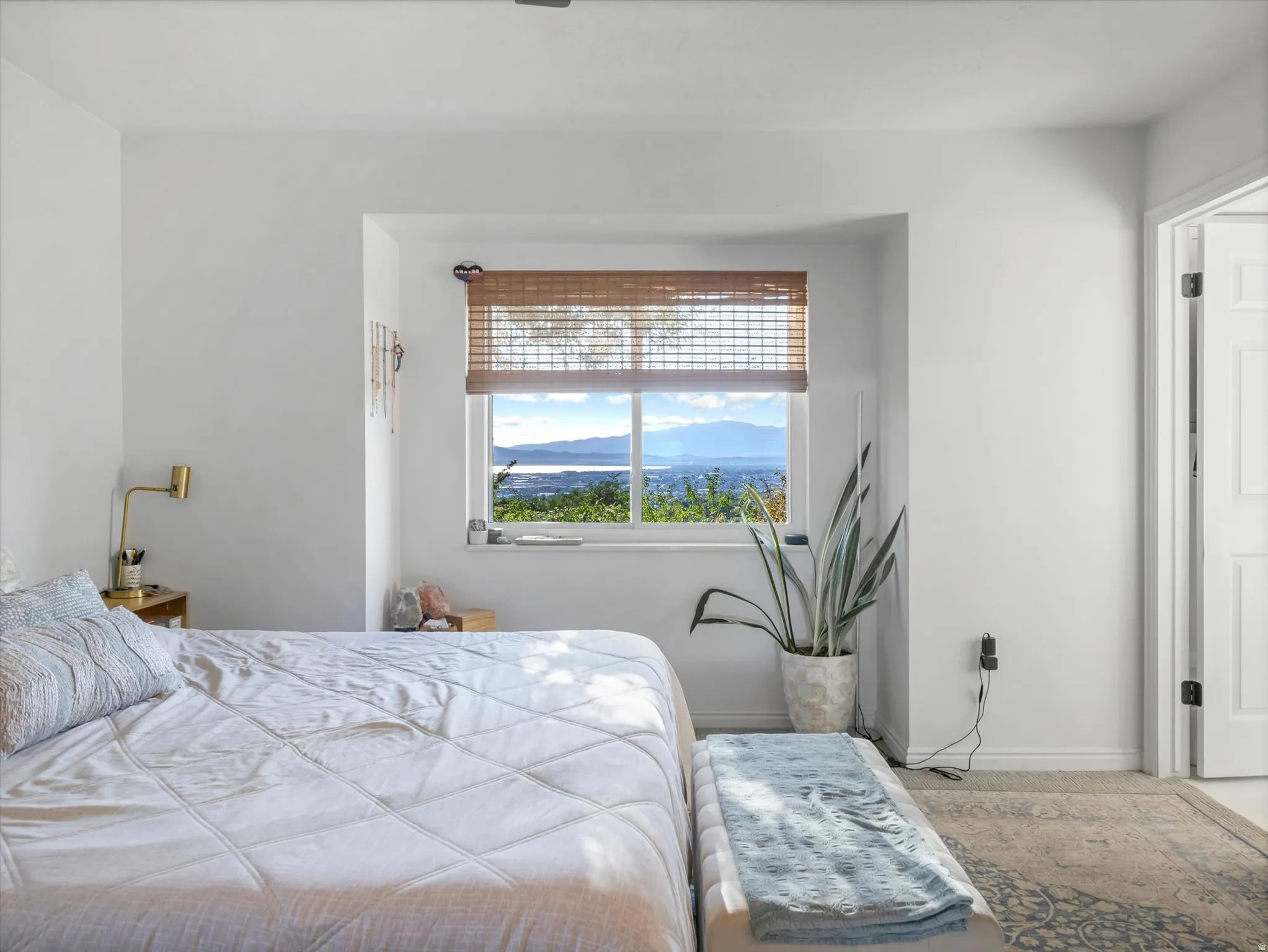 Recessed window featuring a mountain and water scenery