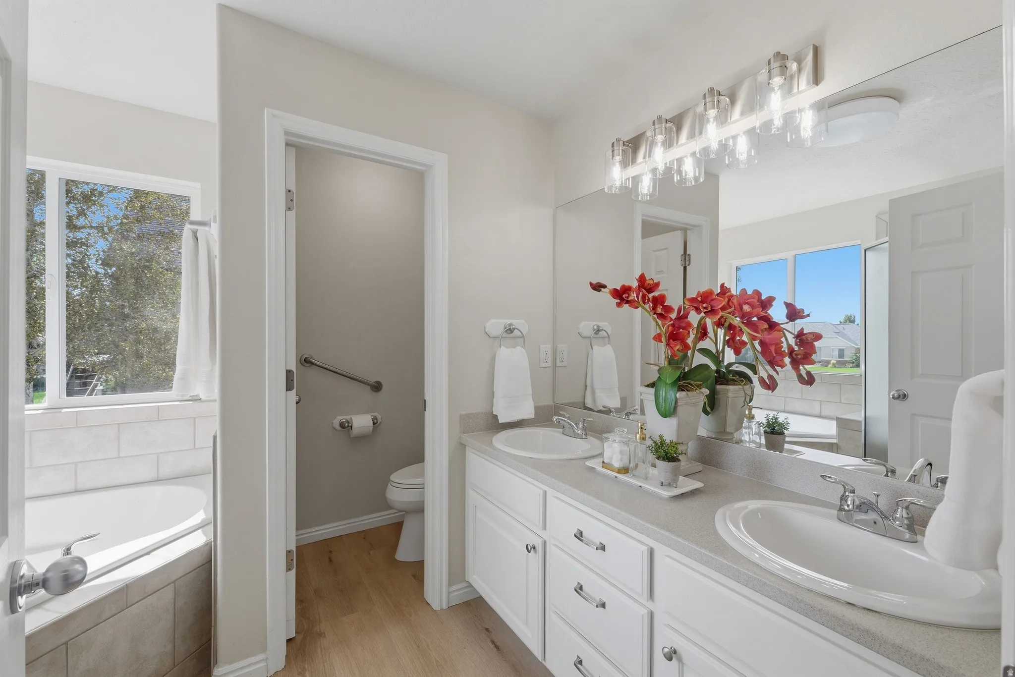 Primary bath with dual vanity and toilet room