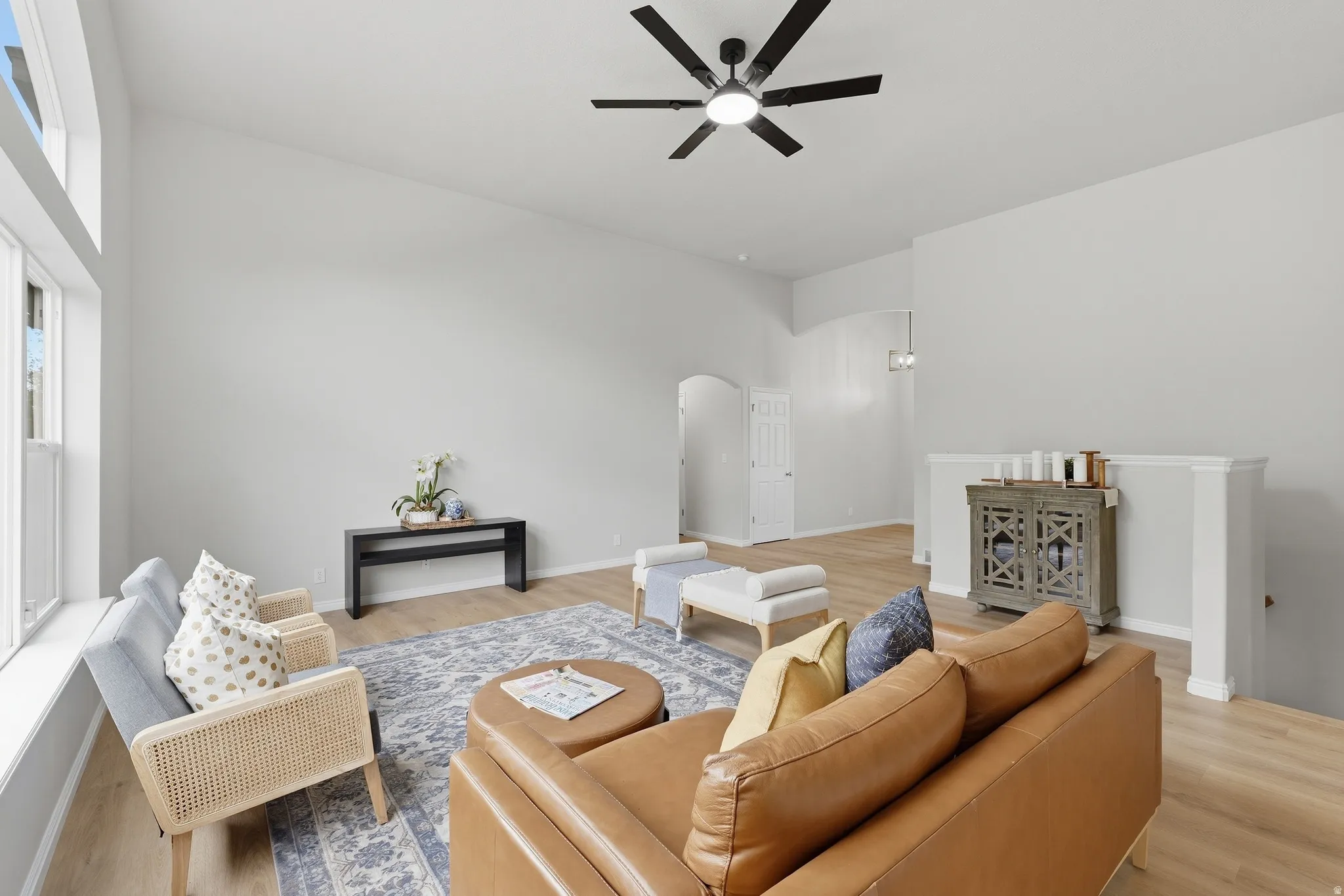 Open concept living area with vaulted ceilings and LVP flooring