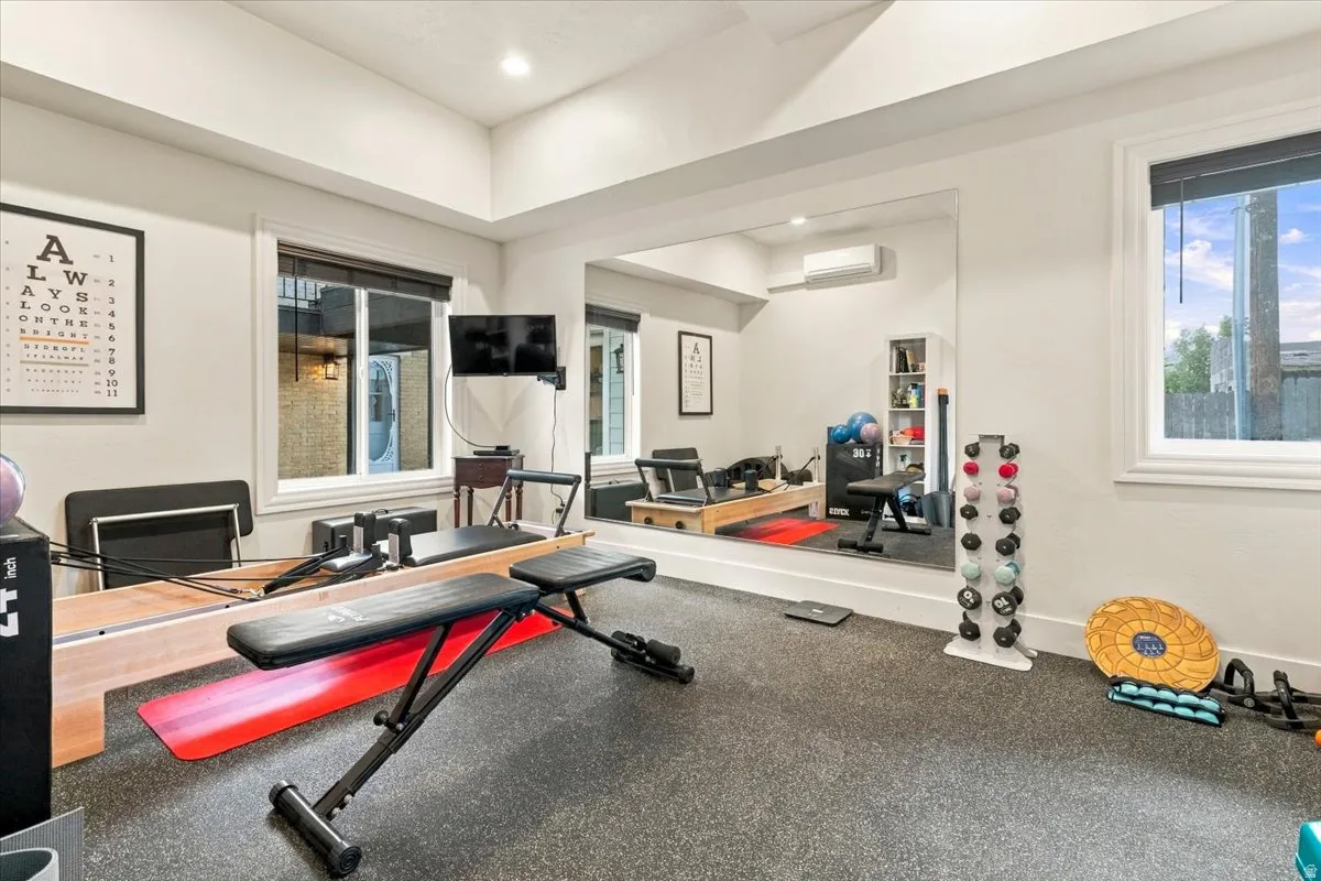 Recessed lighting, large wall mirror, and dual windows