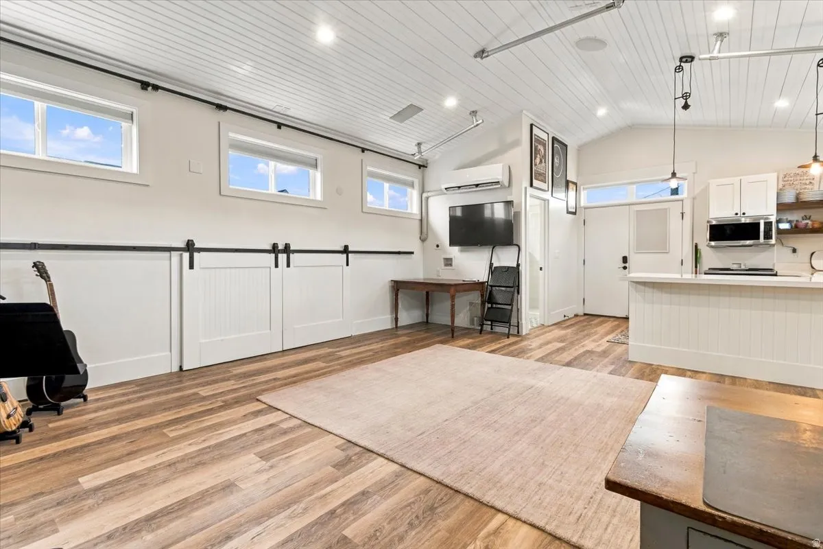 Vaulted tongue-and-groove ceiling with recessed lighting