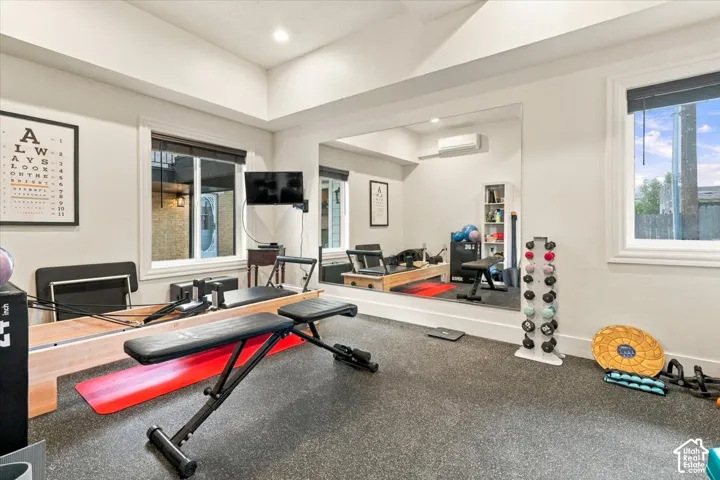 Recessed lighting, large wall mirror, and dual windows