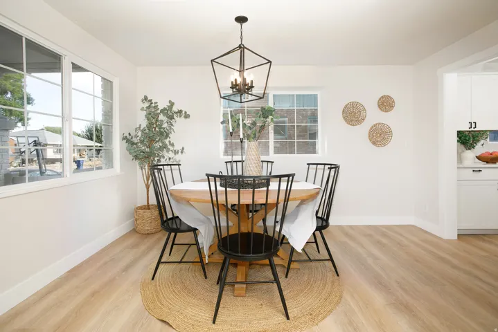 Light wood-finish flooring with white walls