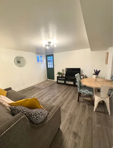 Wood-finish flooring throughout, complemented by a modern ceiling light fixture