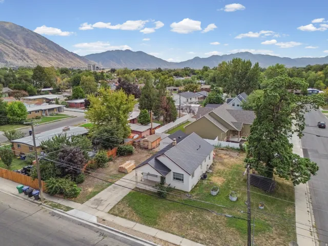 Aerial View – Neighborhood – A peaceful, tree-lined residential setting with easy street access from two sides of this corner property.