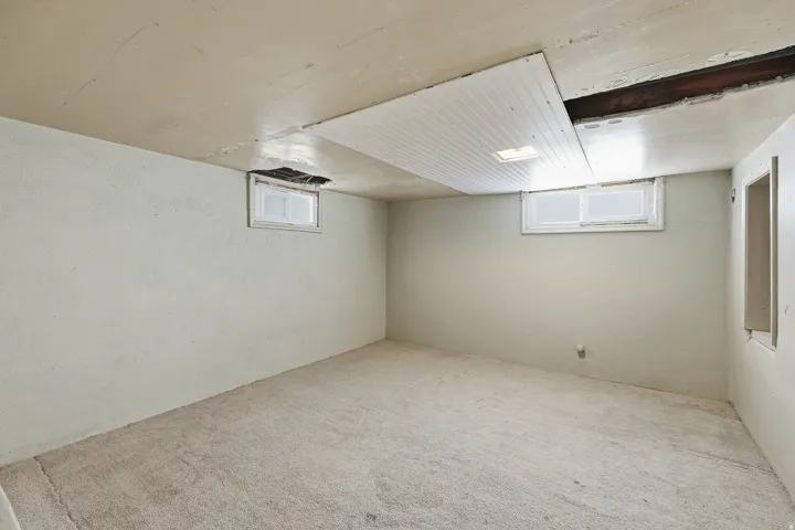 Basement Space – Ready for the next owner's vision, this framed basement room includes natural light from twin windows.ent