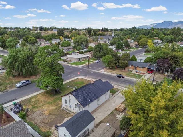 Aerial View – Community – Nestled among mature trees near a local church and community streets, this home enjoys a quiet, established setting.