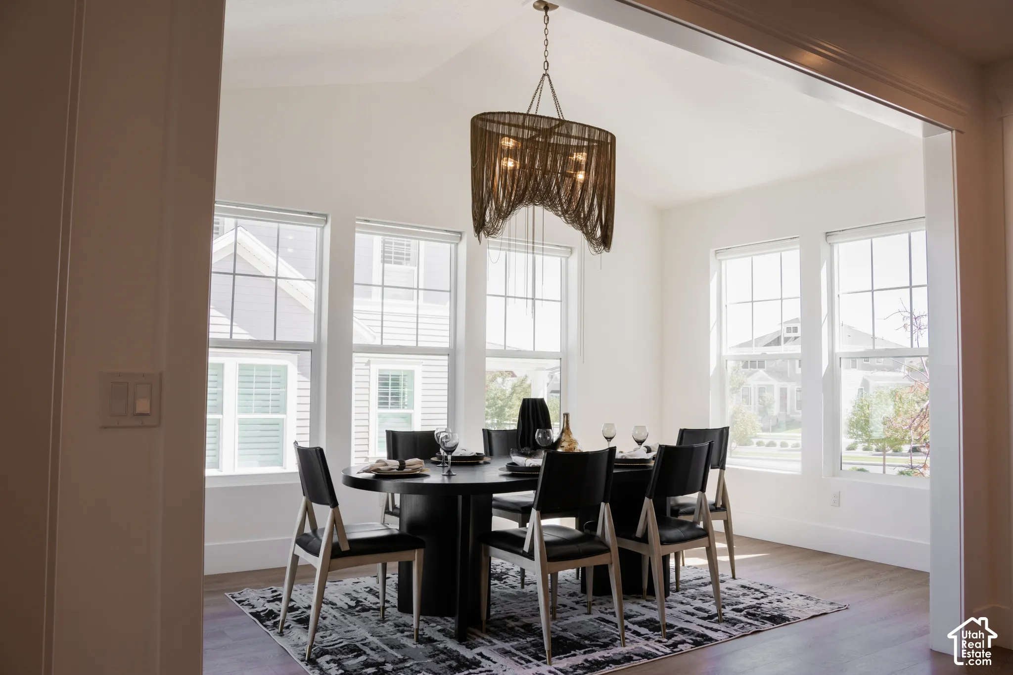 Dining area featuring a vaulted ceiling and an ornate chandelier