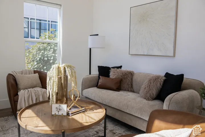 Bright interior with a large window and wood-finish flooring