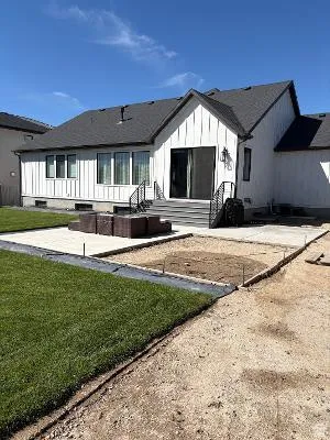 White vertical plank siding and dark shingle roofing