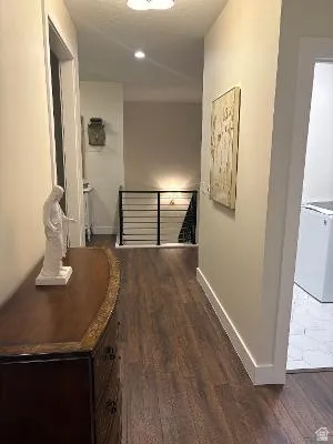 Wood-finish flooring throughout the hallway