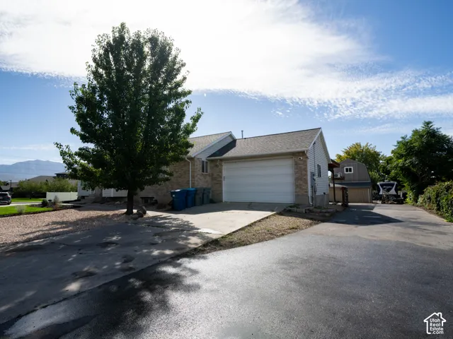 Brick and siding exterior with an attached garage