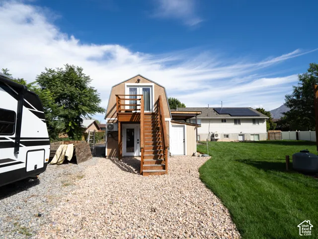 Detached structure upper level remote office and lower level exercise room