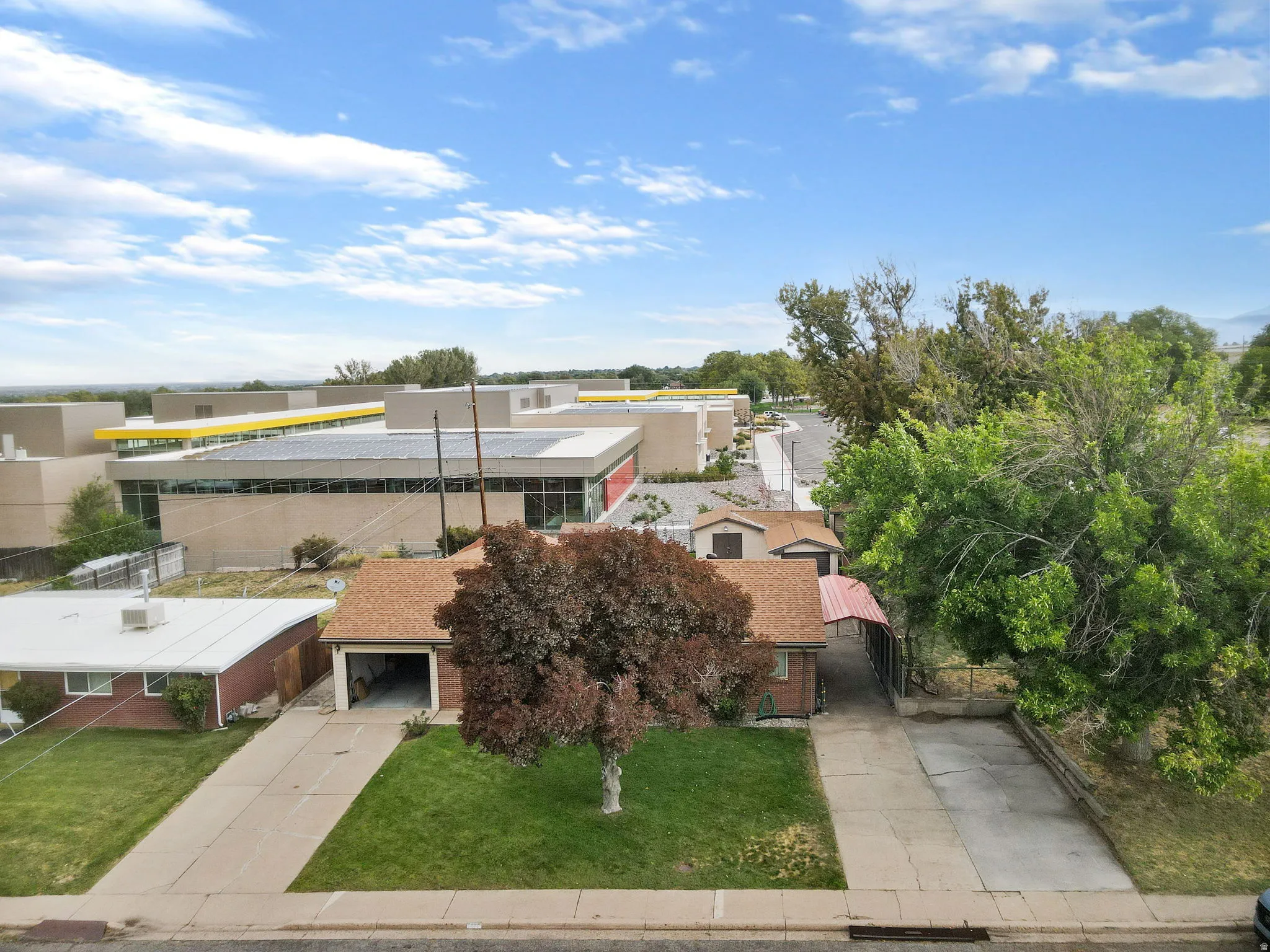 Expansive paved driveway and attached garage