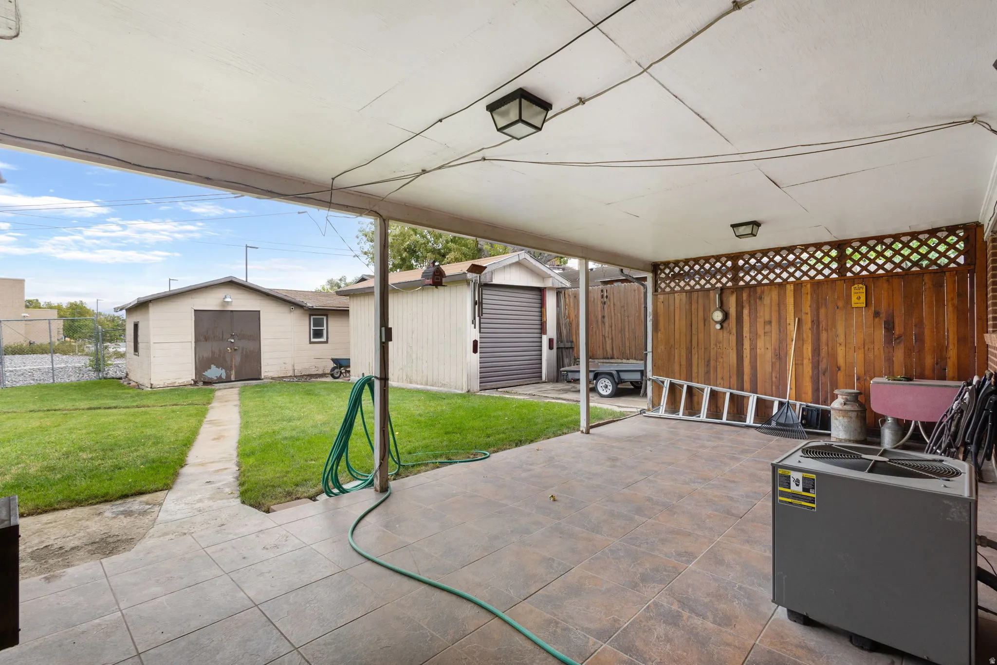 Covered patio featuring tiled flooring and integrated ceiling lights