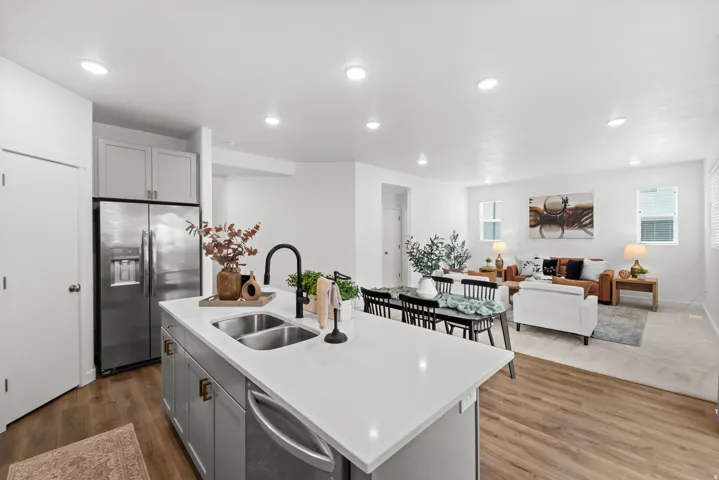 Kitchen island with a double basin sink and matte black faucet