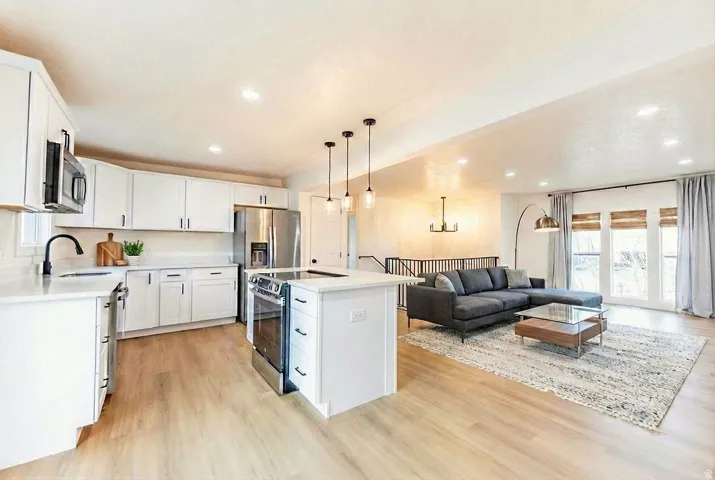 Open-concept living area with wood-finish flooring