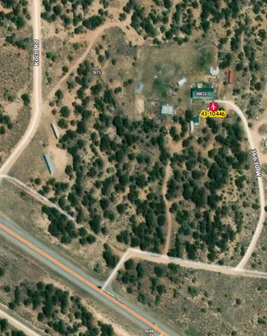 Aerial Map. Depicting the property’s location relative to roads and other structures, with identifying numbers and codes for the water well.