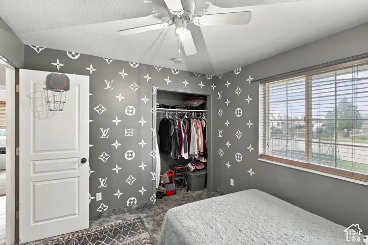 Built-in closet with hanging rods and shelving
