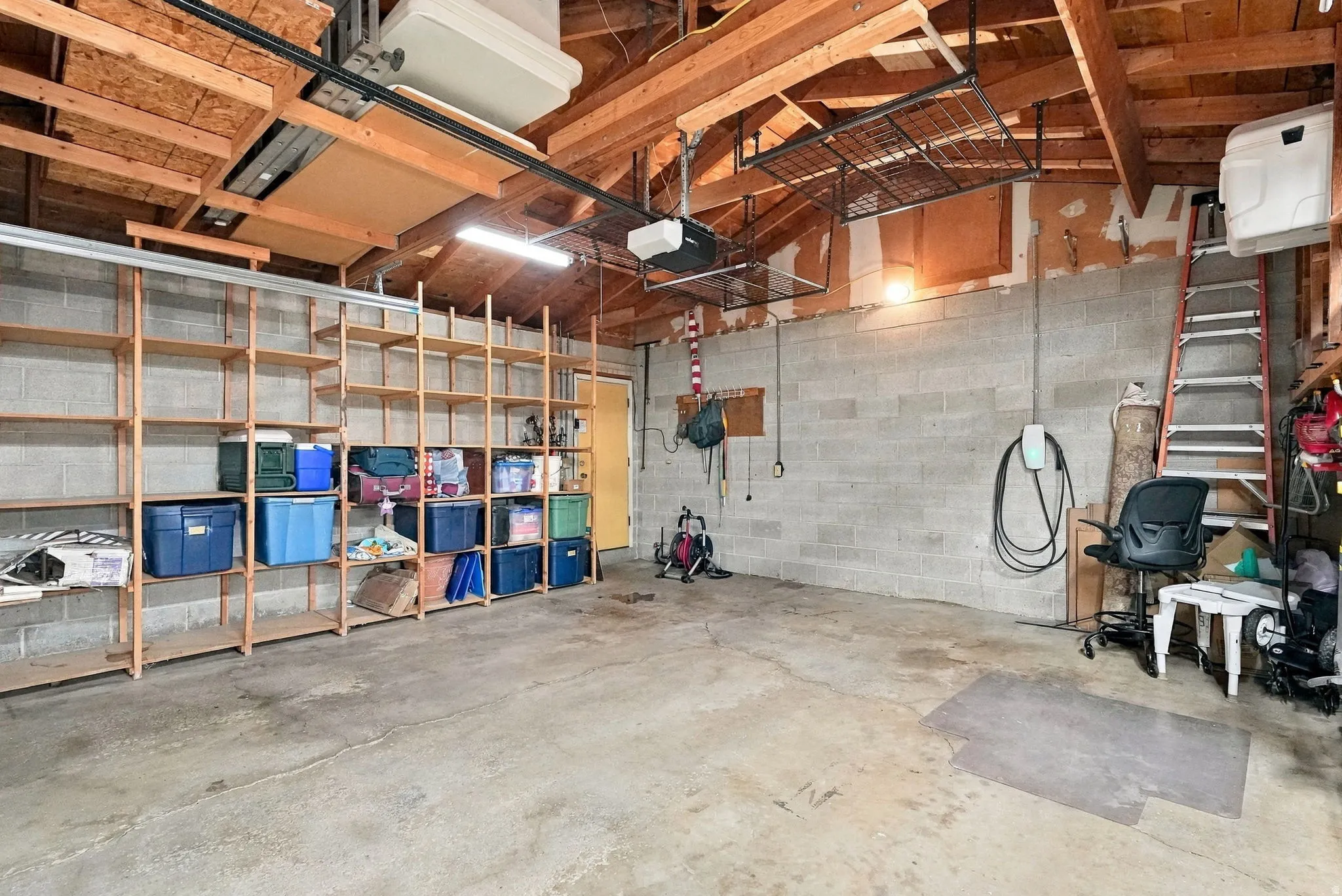 Attached wooden shelving units provide extensive storage