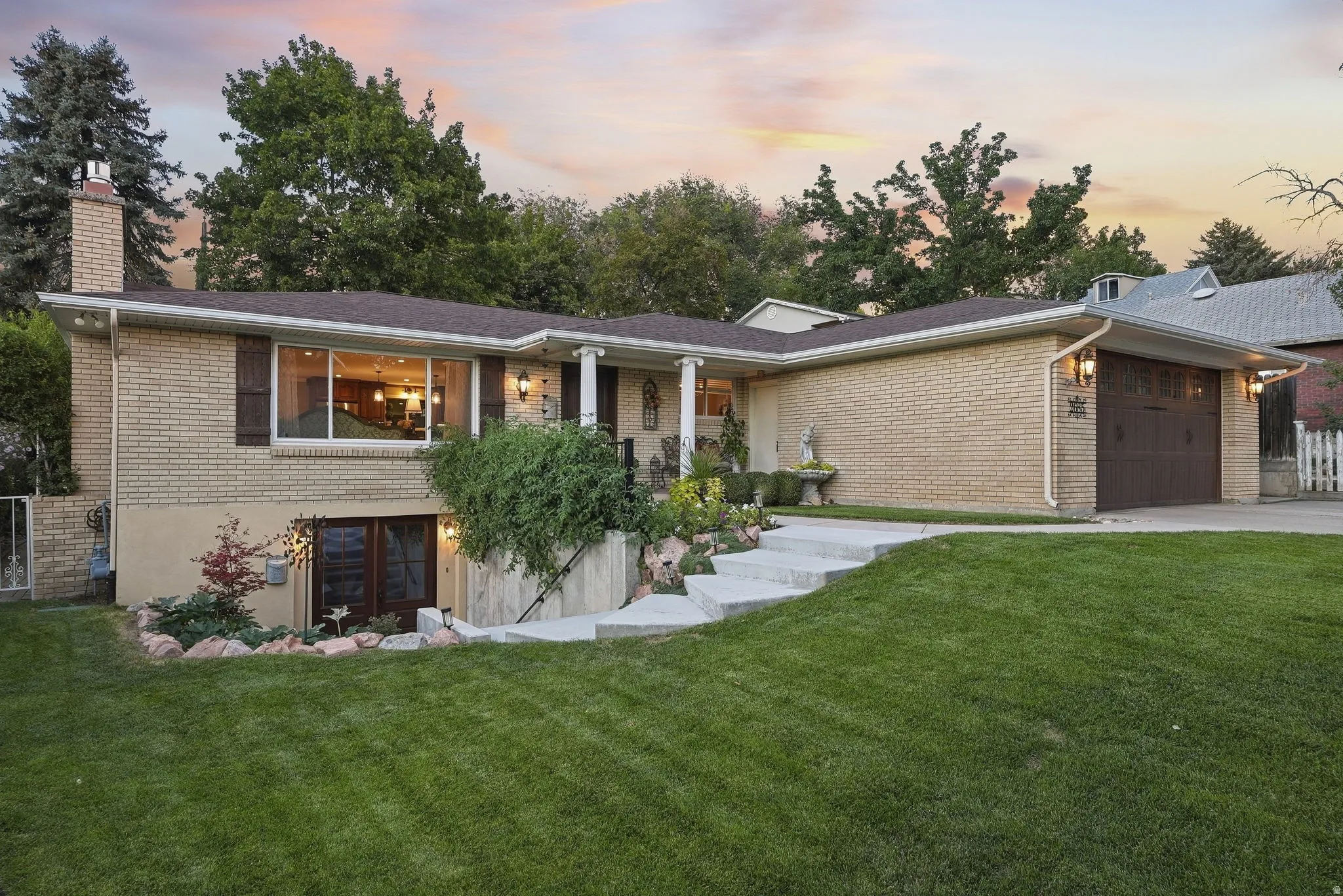 Brick exterior with a brown roof and white trim