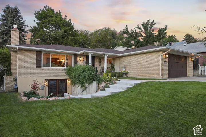 Brick exterior with a brown roof and white trim
