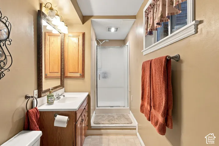 Wood-finish vanity with an integrated sink and base cabinetry