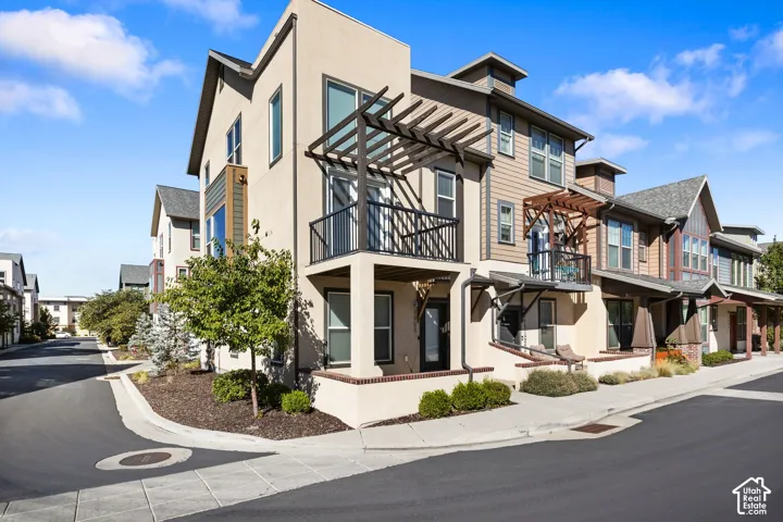 Multi-level exterior with stucco and siding finishes