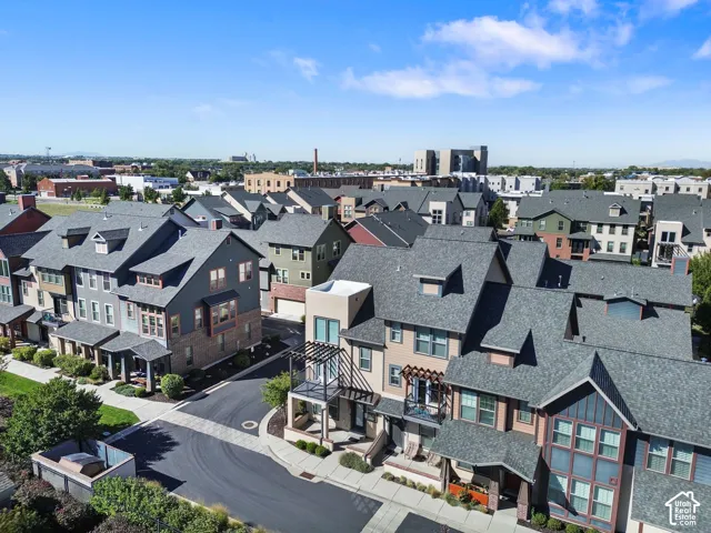 Modern townhome community featuring diverse architectural styles, multi-level designs, and gabled roofs