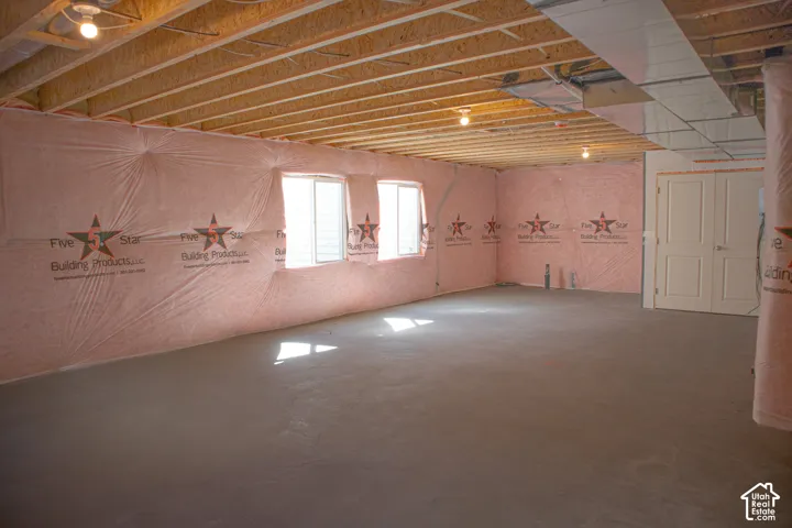 Unfinished basement with potential for large family/game room, storage room, full bathroom and one bedroom.