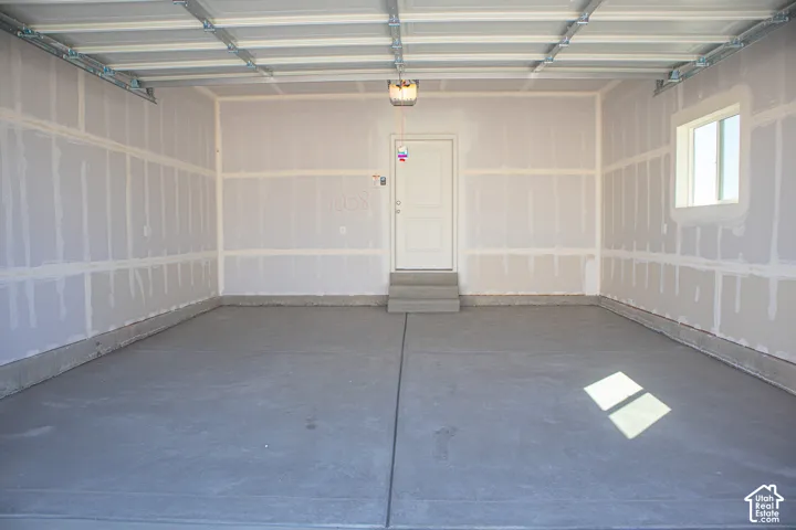Two-car garage with taped finish.