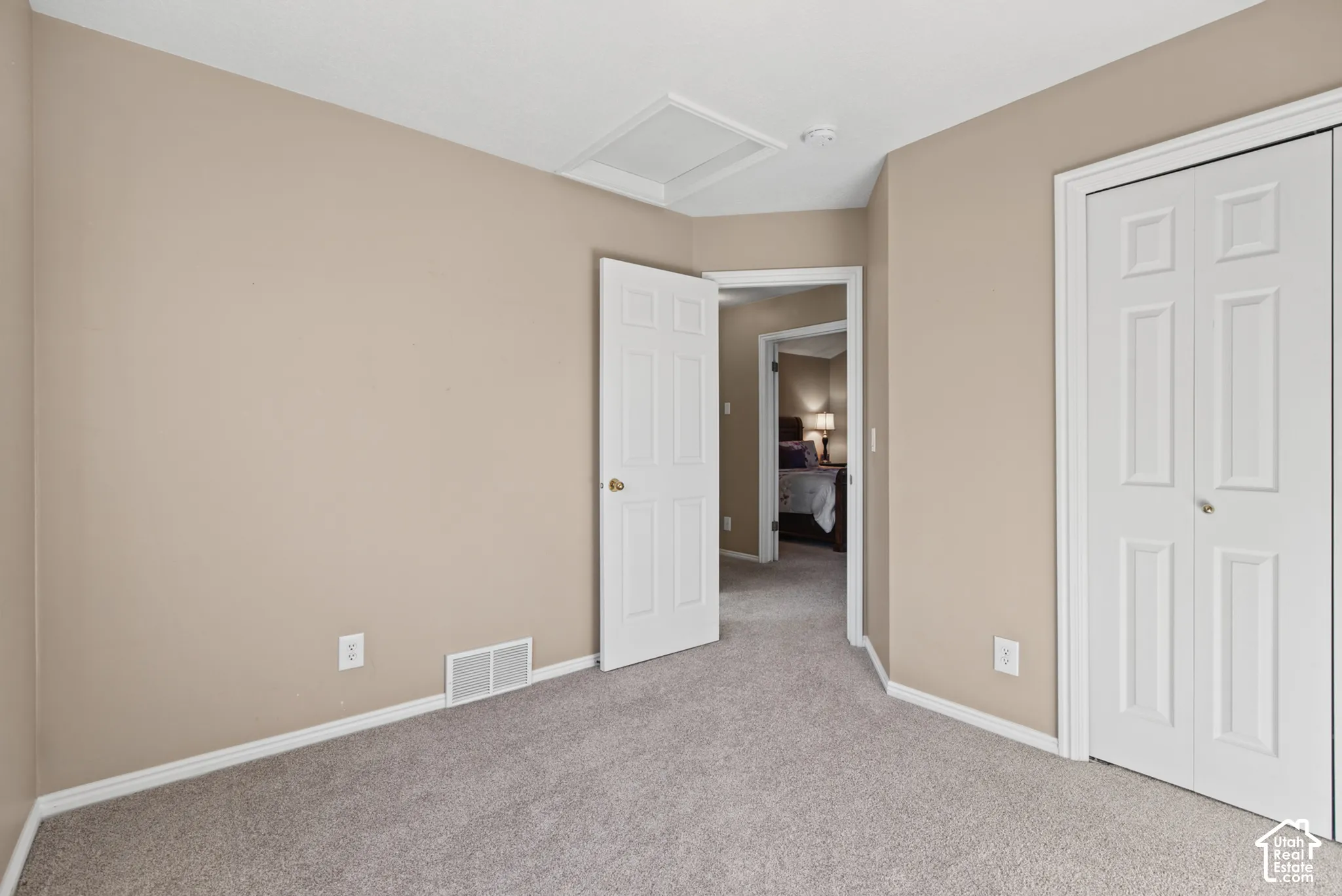 Plush carpeting and neutral-toned walls