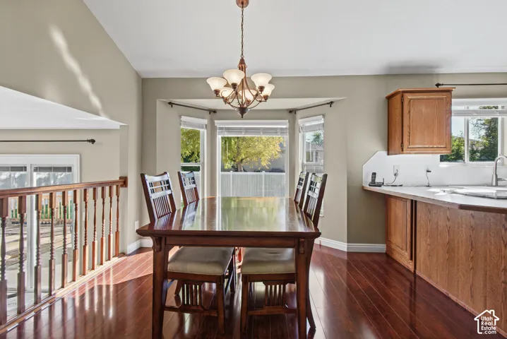 Hardwood-finish flooring, bay windows, and a built-in kitchen counter with wood cabinetry