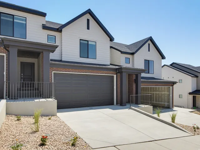 Contemporary exterior design with vertical siding and brick accents