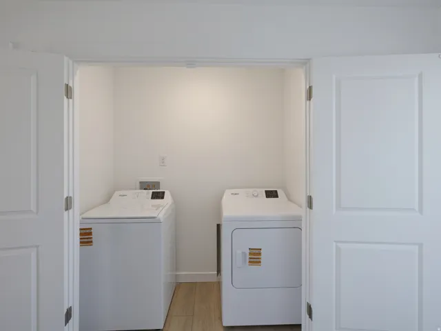 Laundry closet with a full-size washer and dryer