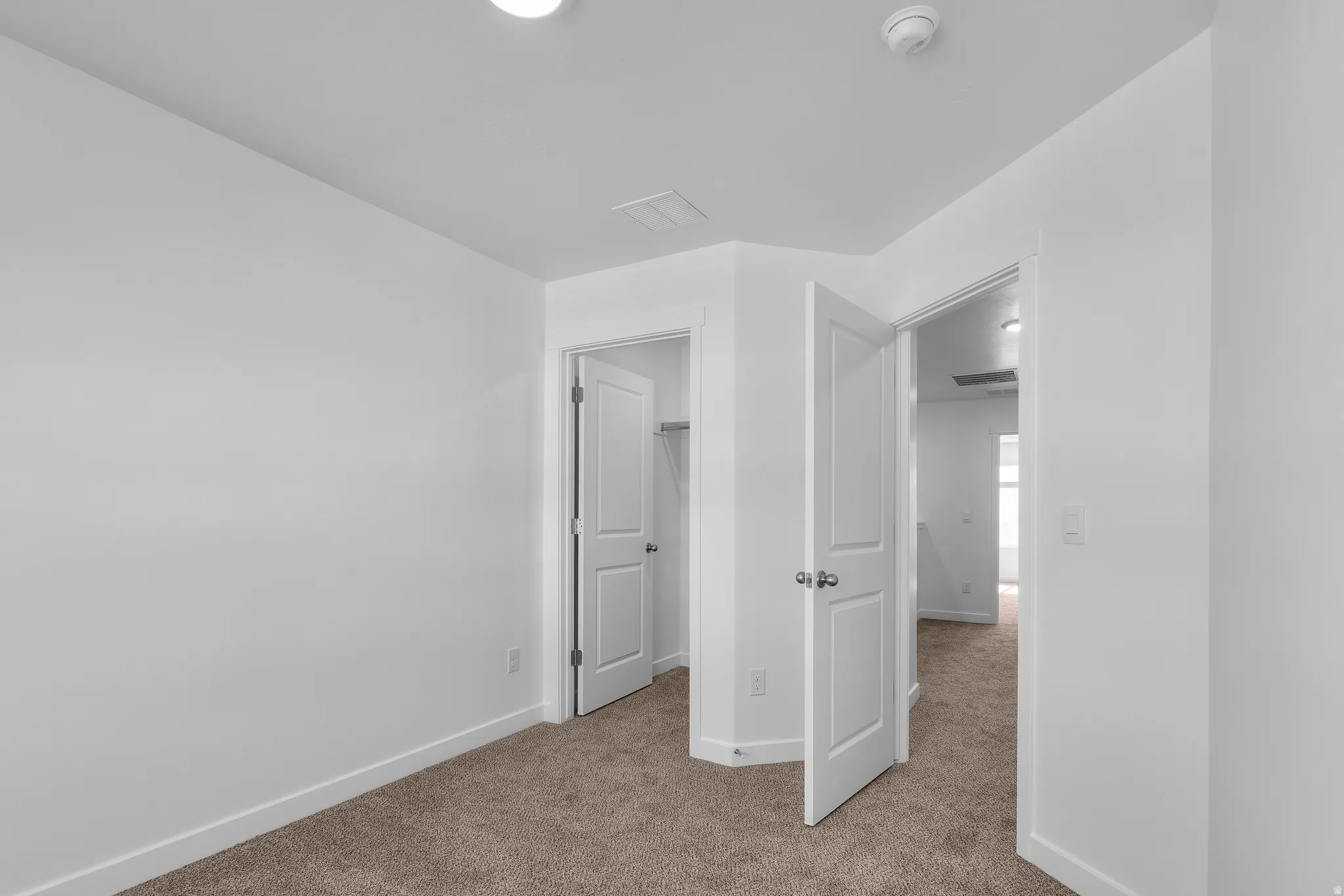 Plush carpet flooring and crisp white walls