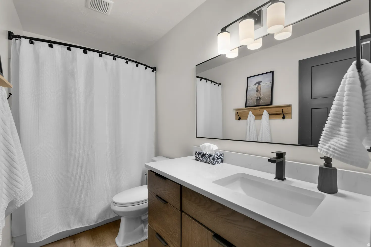 Vanity with quartz countertop and undermount sink