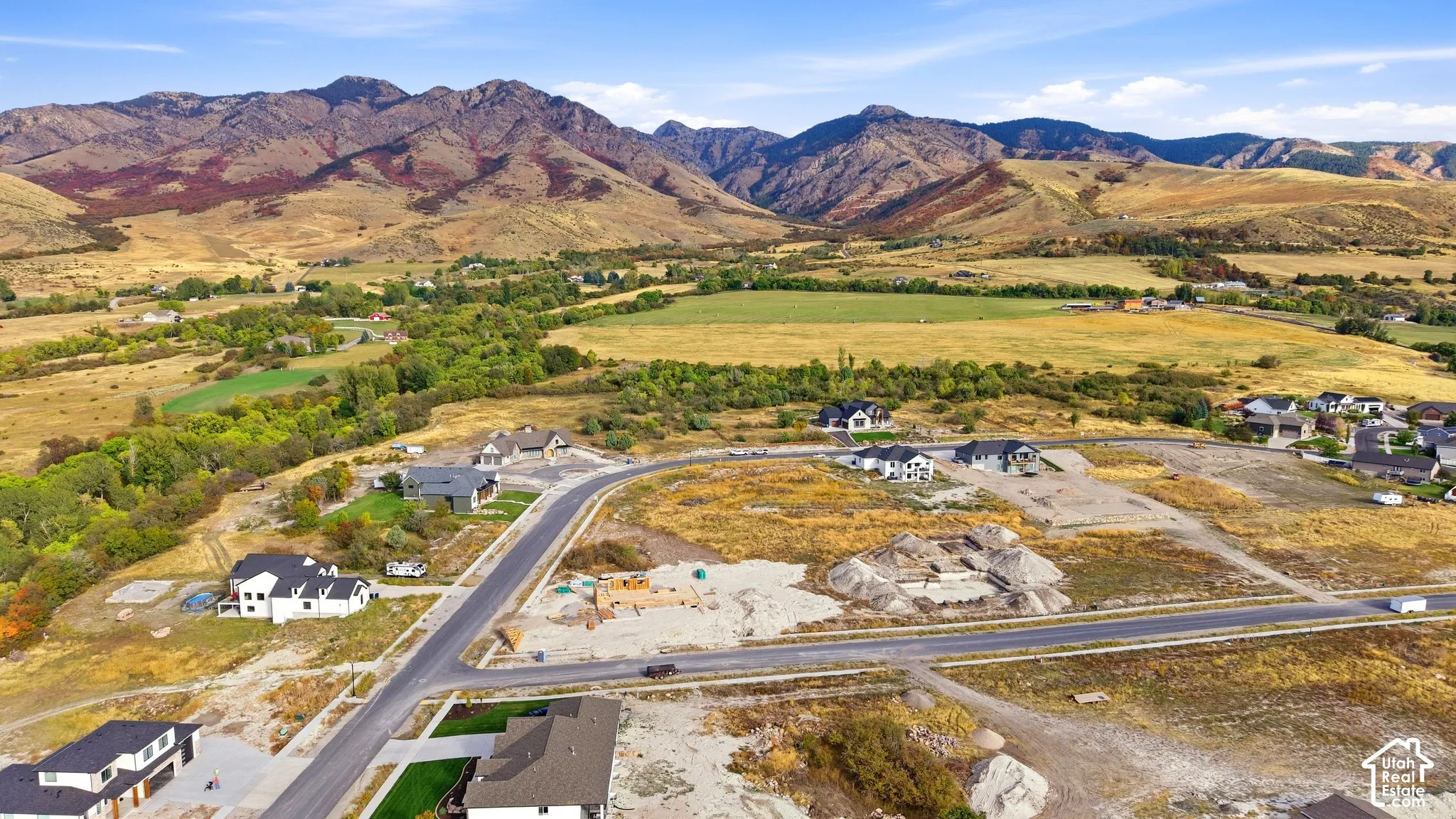 Expansive mountain range backdrop and rural scenery