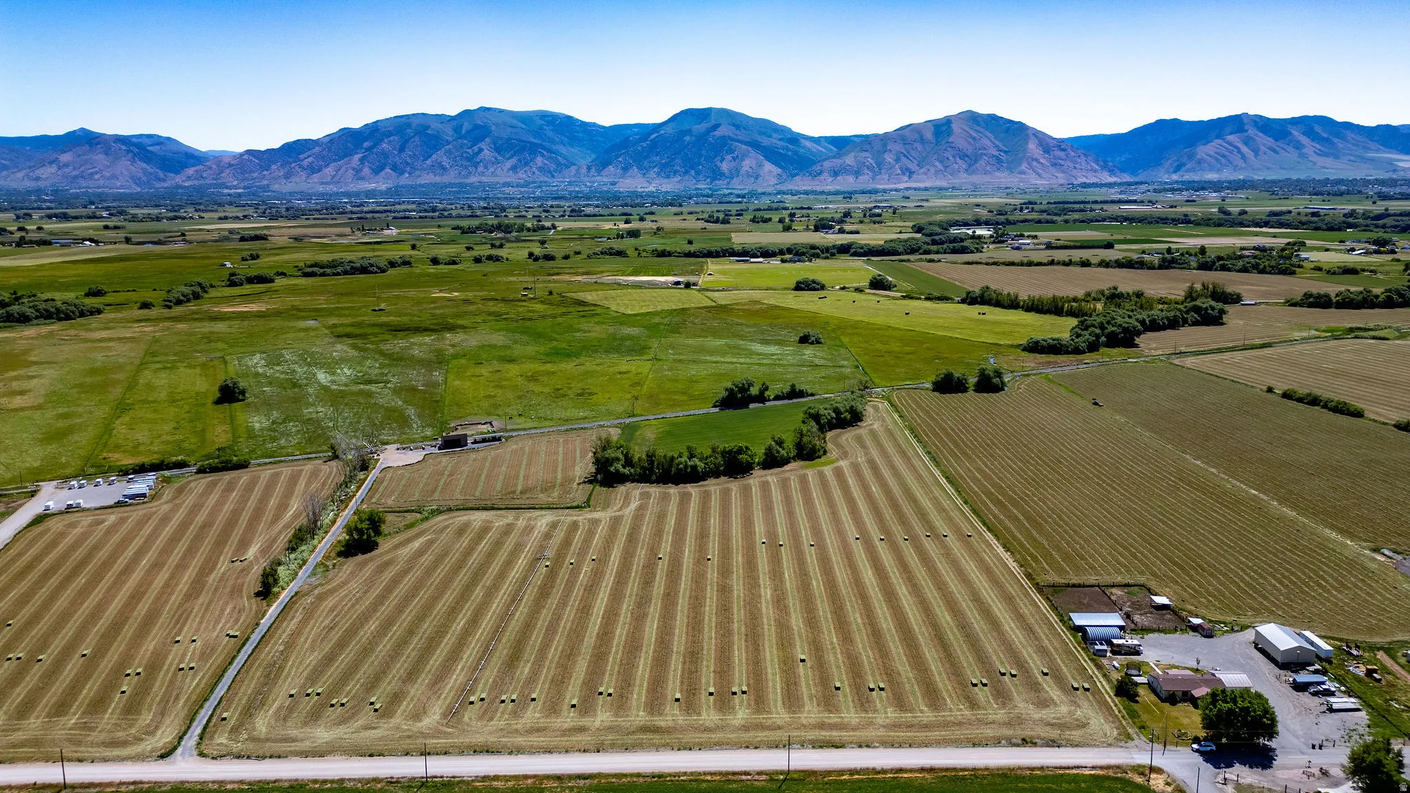 Expansive agricultural property featuring cultivated fields and a rural setting