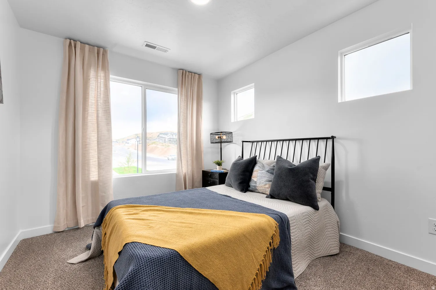 Wall-to-wall carpeting with a bright white color palette