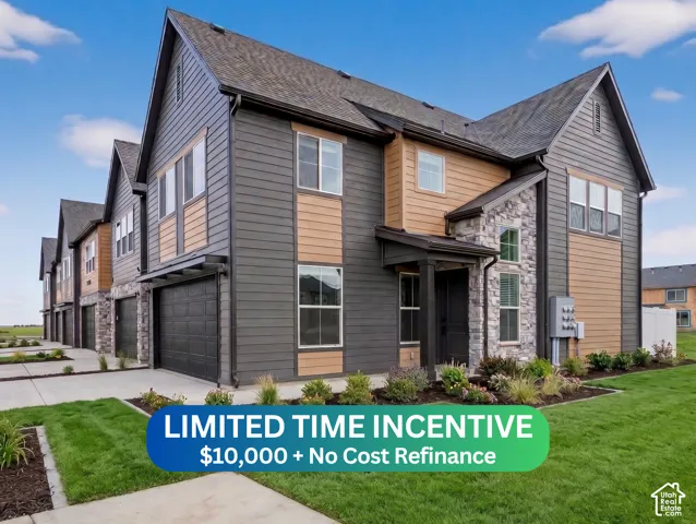 Exterior featuring dark horizontal siding, light wood-tone accents, stone veneer detailing, a two-car garage, and a covered entry