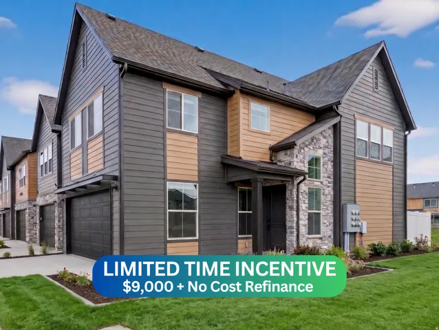 Multi-level exterior featuring dark gray siding, light wood-tone accents, and stone veneer