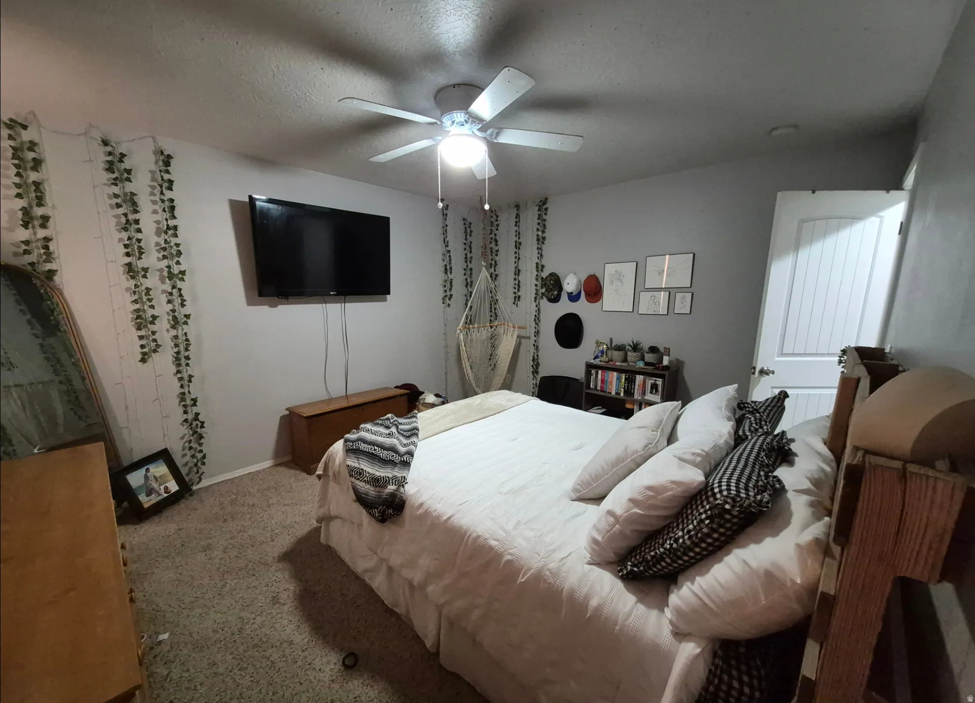 Wall-mounted television with visible wiring