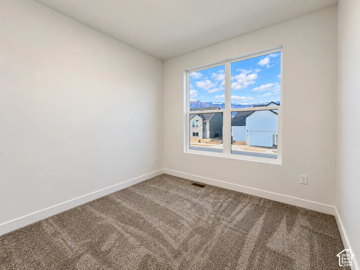 Neutral wall finishes and plush carpeting