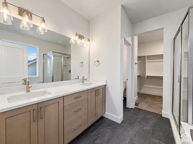 Dual vanity with undermount sinks and light-toned cabinetry