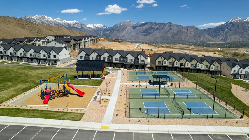 Community amenities including a playground, covered pavilion, and multiple pickleball courts