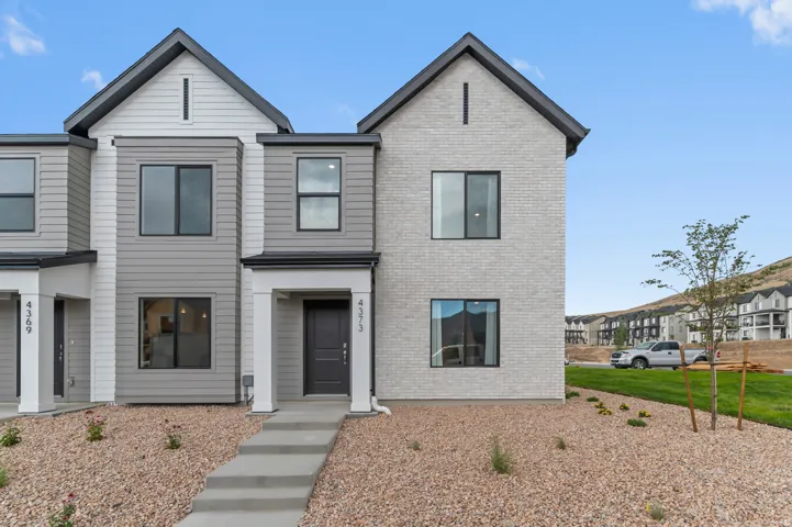 Contemporary multi-level exterior with a gabled roofline