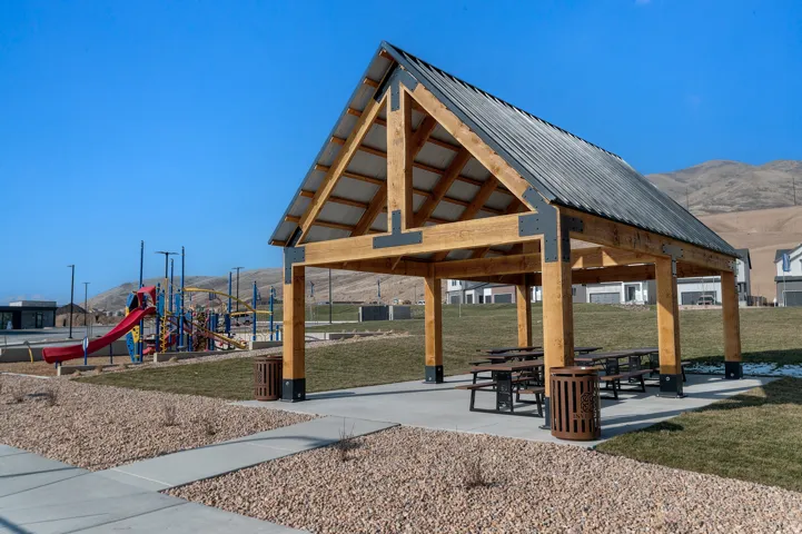 Community park pavilion featuring a wood-frame construction and a metal roof
