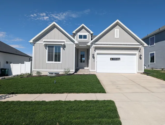 Single-story residence featuring a two-car garage, board and batten siding, and a gabled roofline